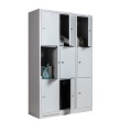 Taquilla 3 puertas 3 cuerpos - Gris - 4 puertas abiertas con accesorios Taquilla 3 puertas 3 cuerpos - Gris - 4 puertas abiertas con accesorios